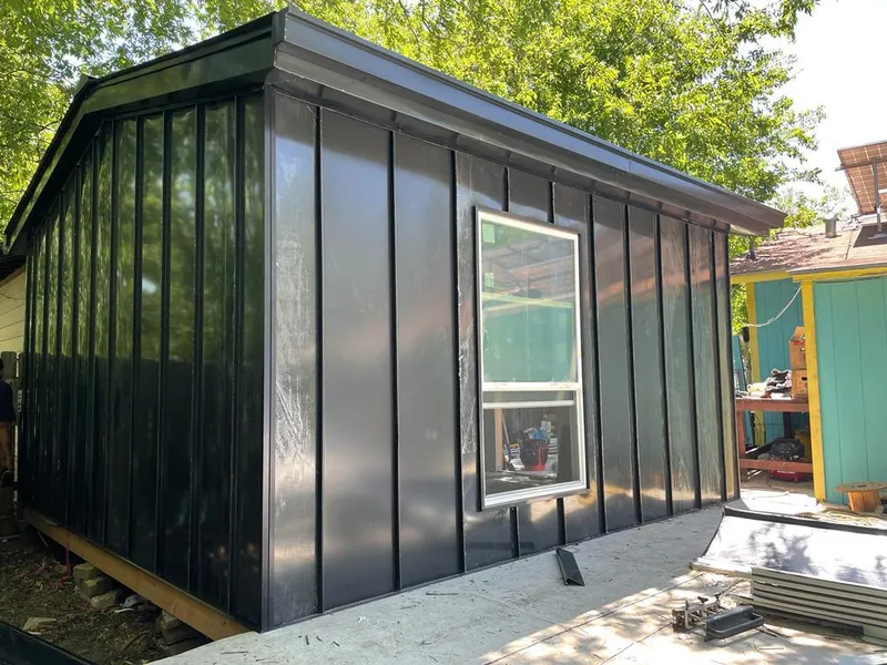 Black standing seam metal wall panels for Roof Inspection in Seattle